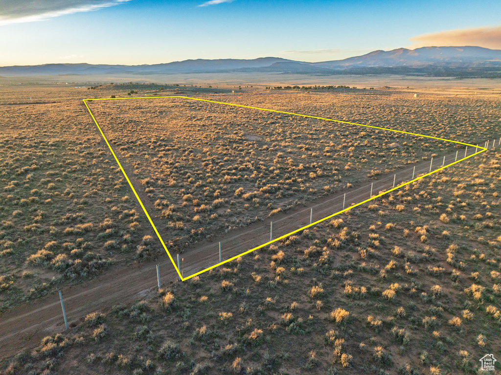 Birds eye view of property with a mountain view and a rural view