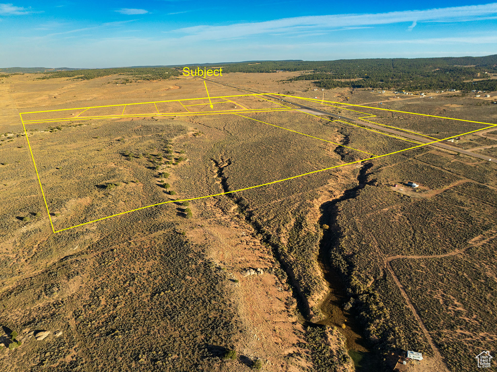 Birds eye view of property featuring a rural view