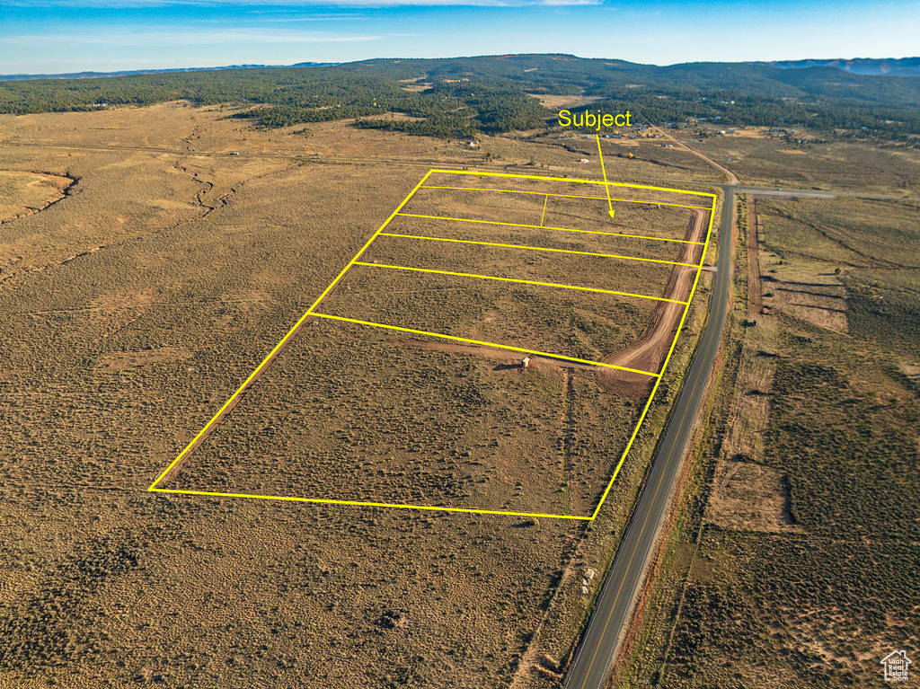 Birds eye view of property featuring a mountain view