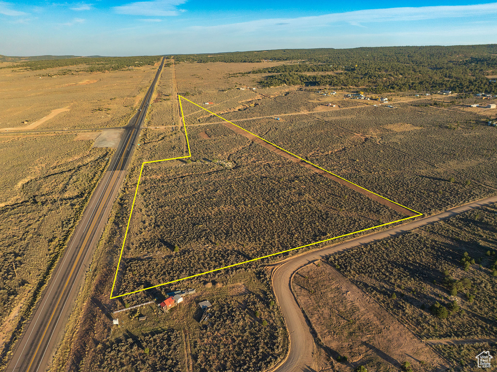 Birds eye view of property featuring a rural view