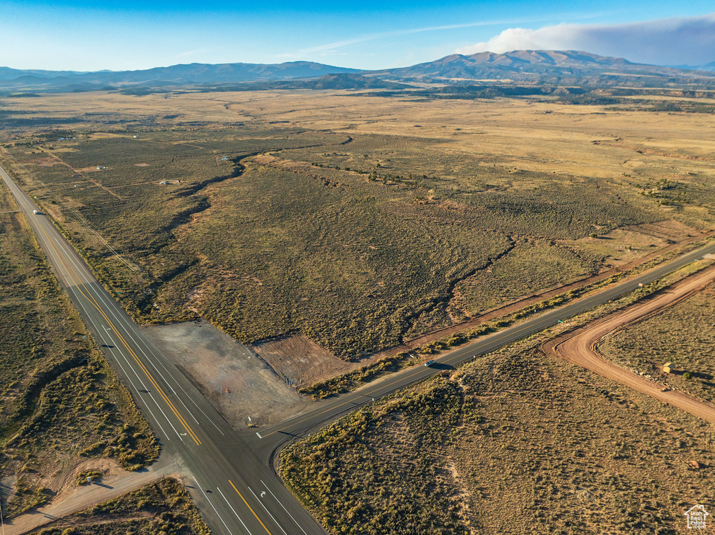 Birds eye view of property with a mountain view