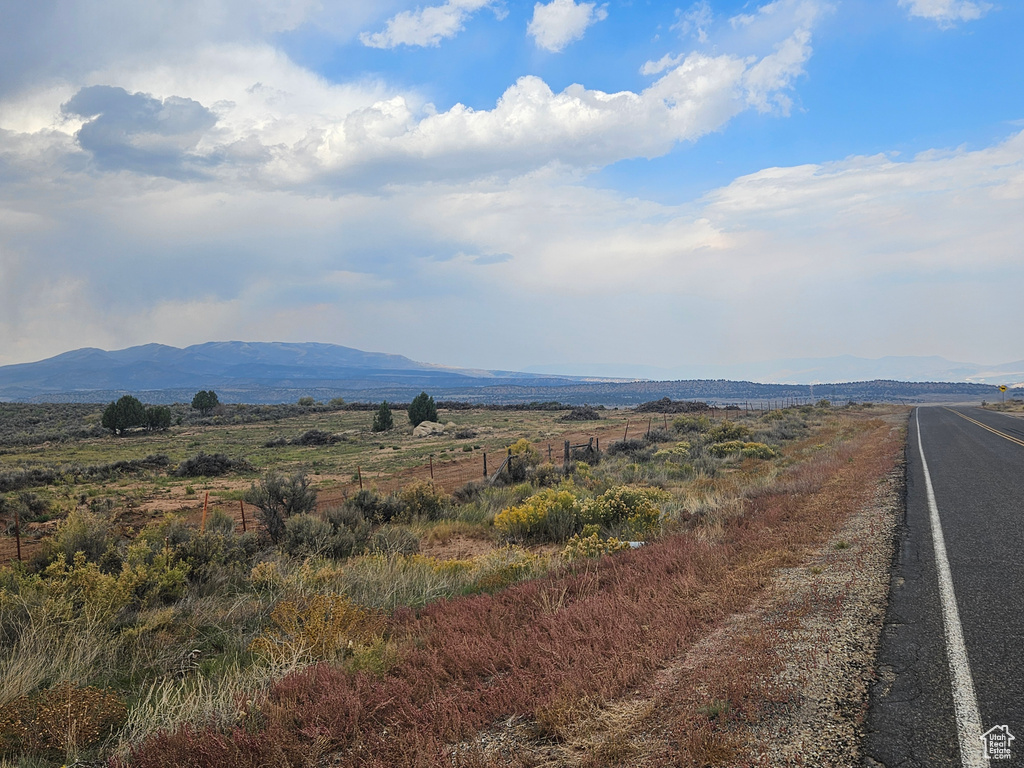 Property view of mountains with a rural view