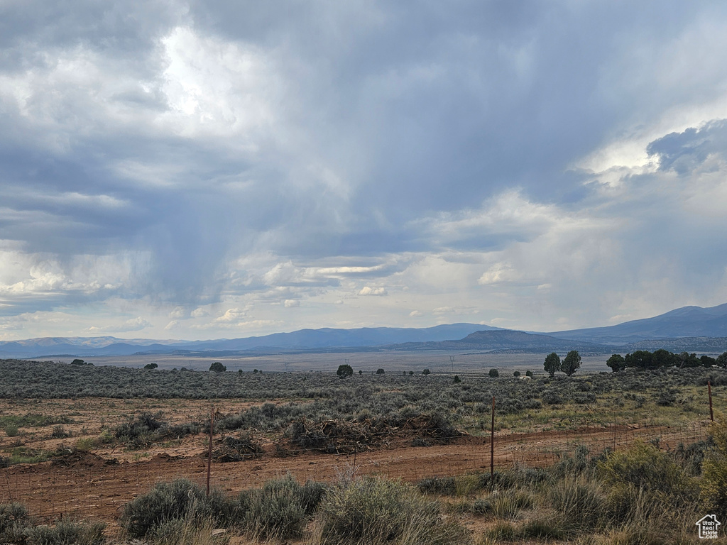 Property view of mountains with a rural view