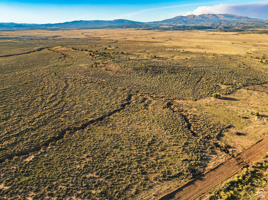 Birds eye view of property with a mountain view