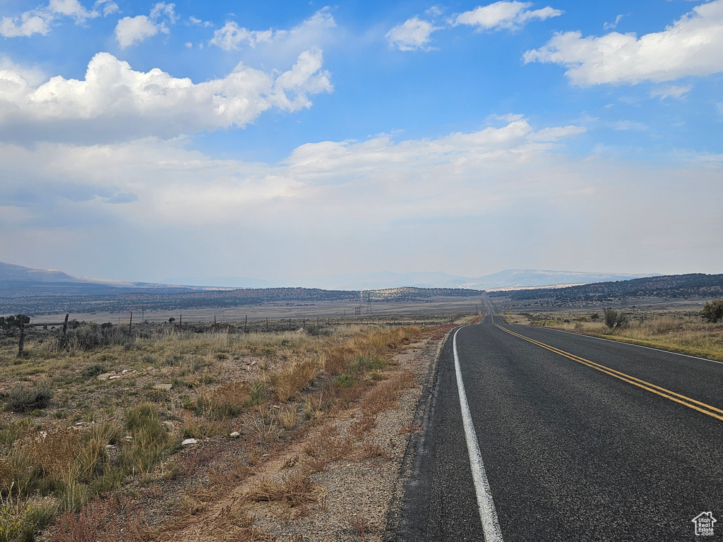 View of road with a rural view and a mountain view