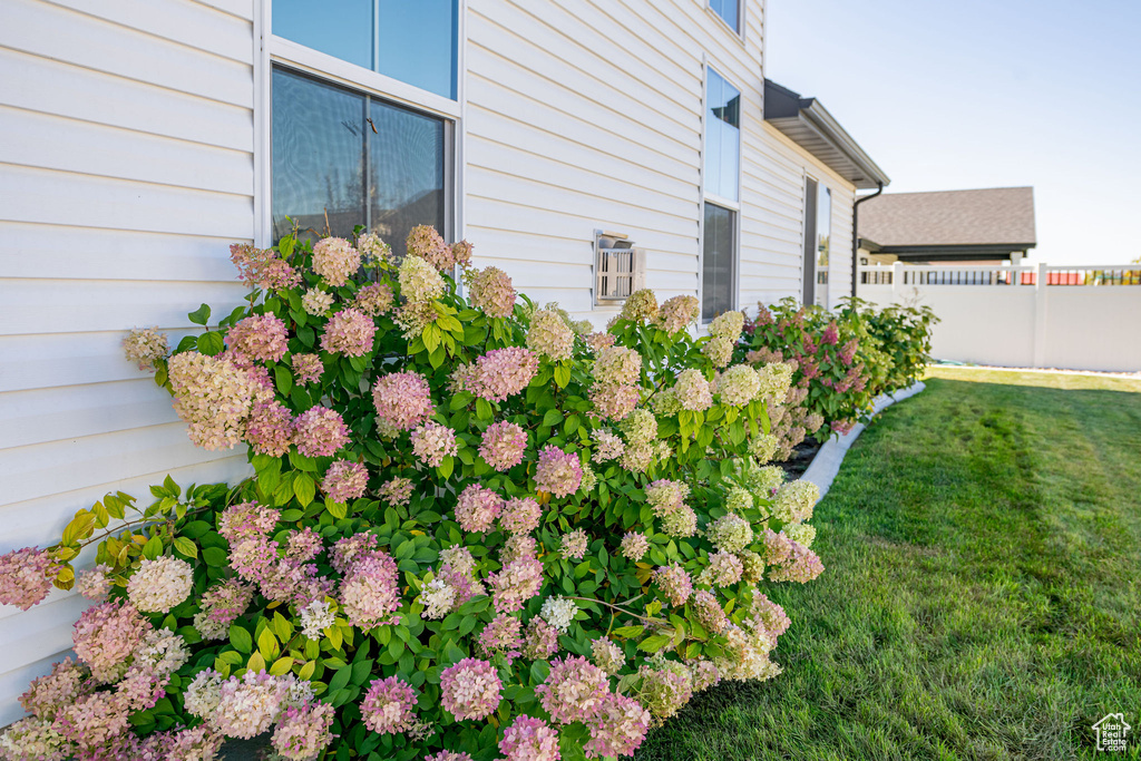 View of side of property with a yard