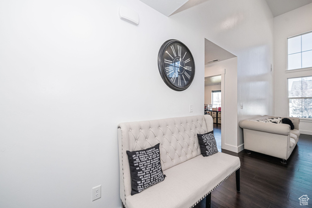 Living area featuring dark wood-type flooring