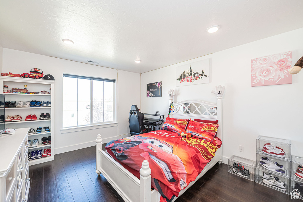 Bedroom featuring dark hardwood / wood-style floors