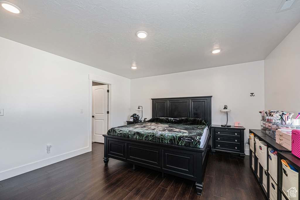 Bedroom featuring dark hardwood / wood-style flooring