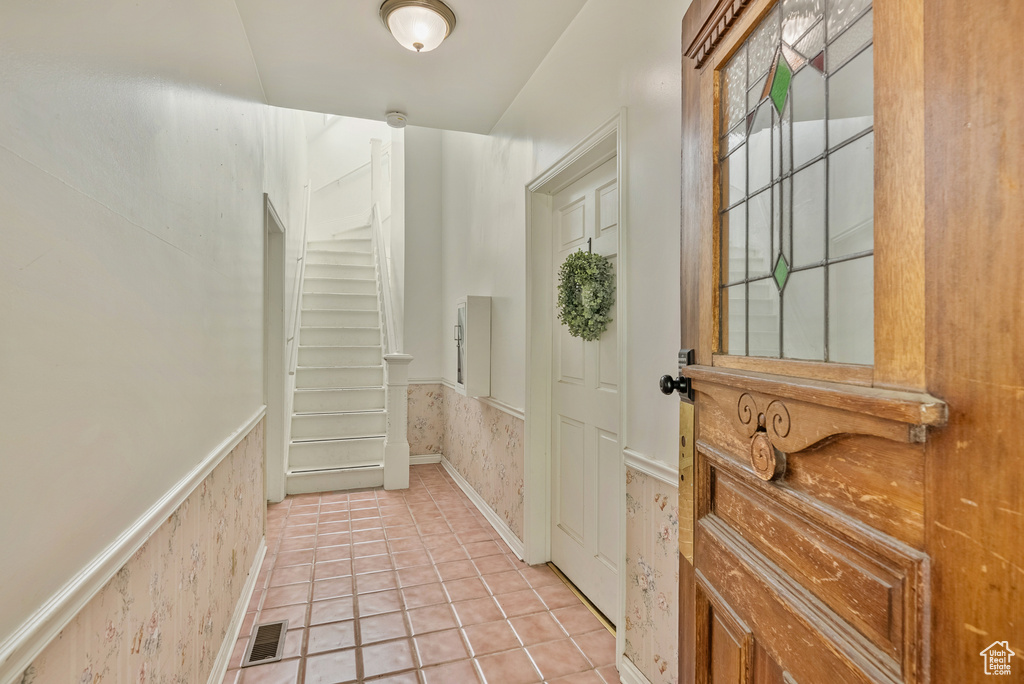 Interior space featuring light tile patterned flooring