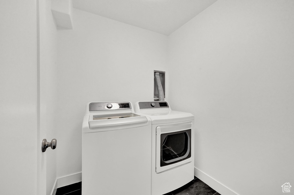 Laundry room featuring independent washer and dryer