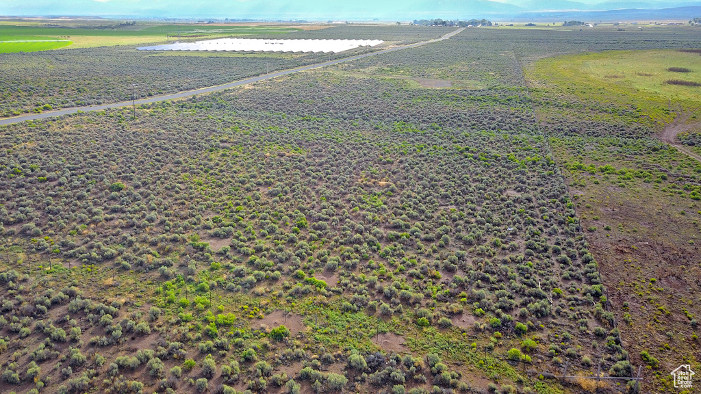 Birds eye view of property featuring a rural view
