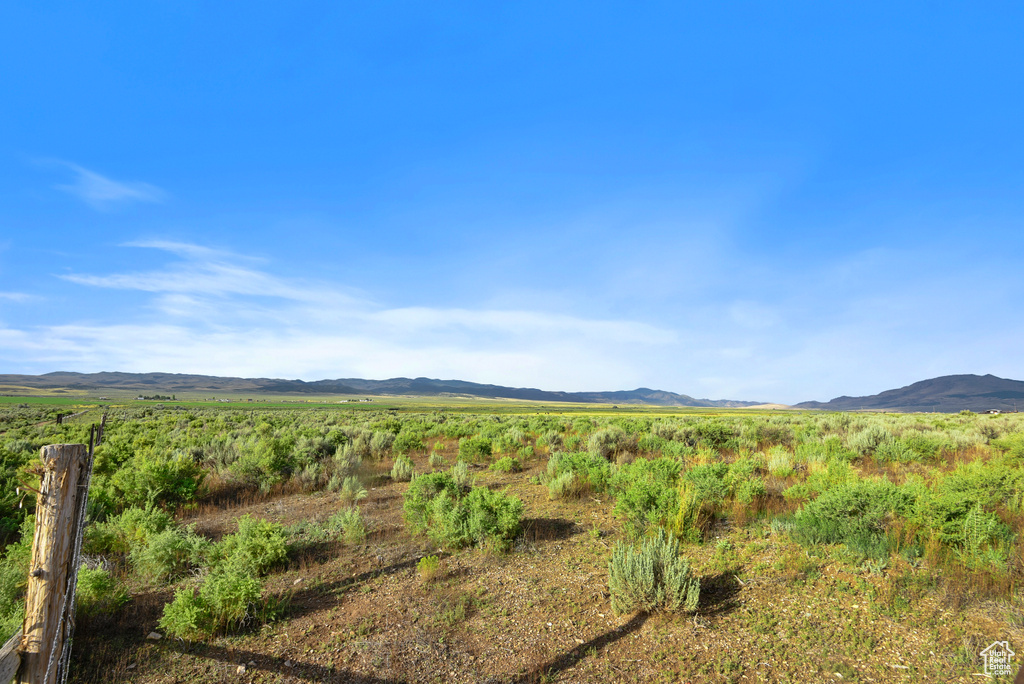 Property view of mountains with a rural view