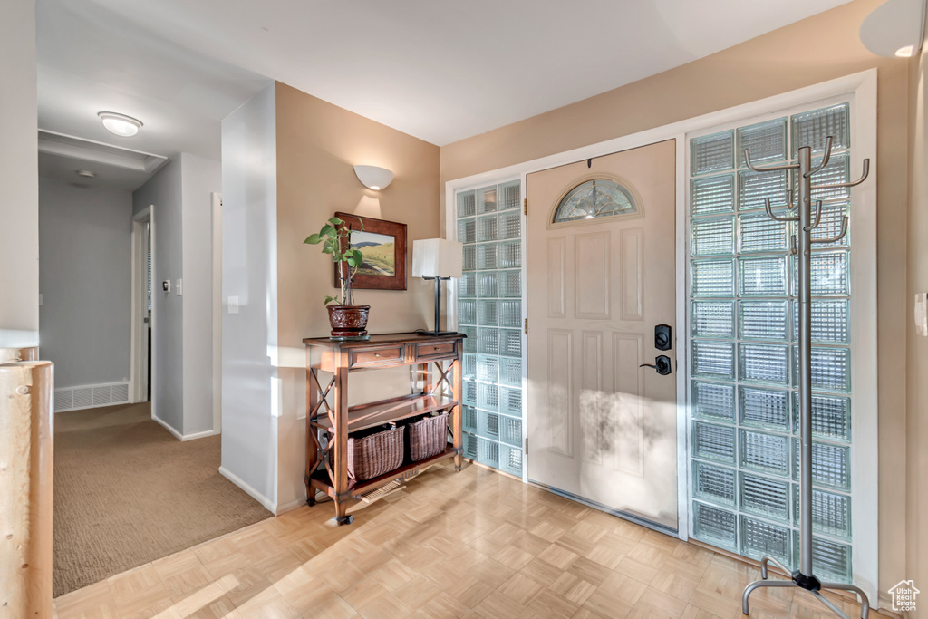 View of carpeted entrance foyer