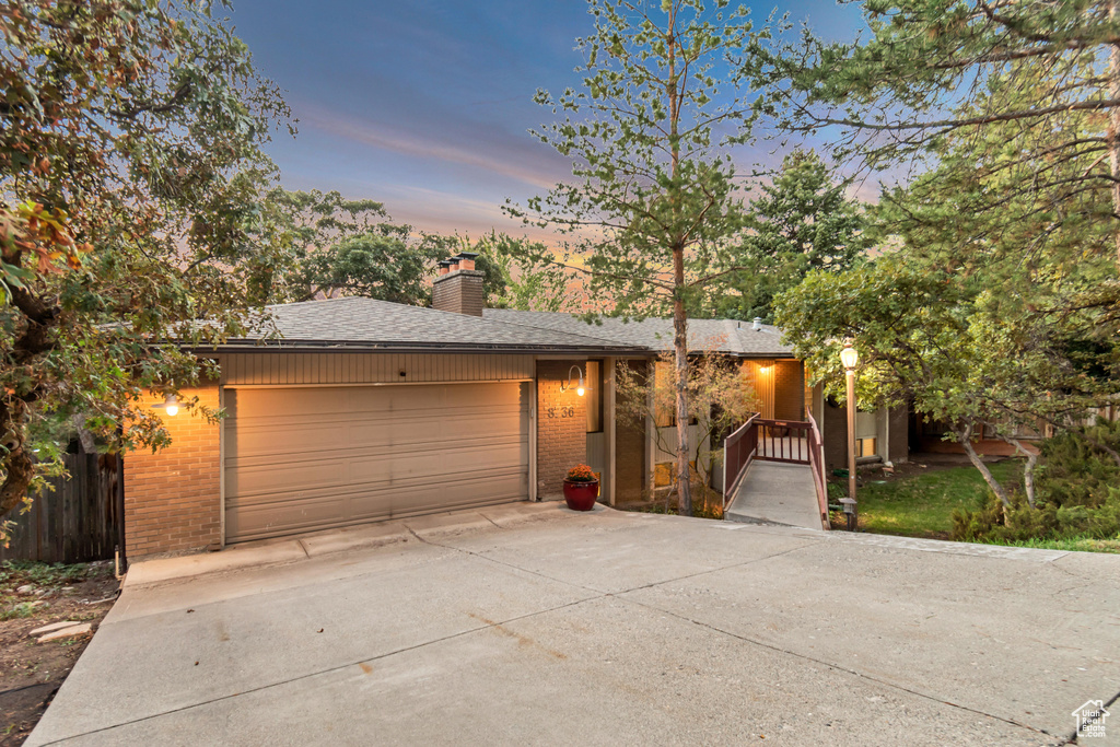 View of front of property featuring a garage