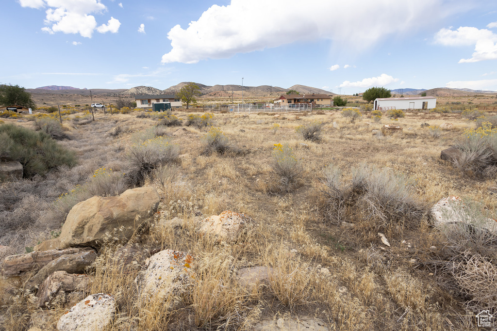 Property view of mountains with a rural view