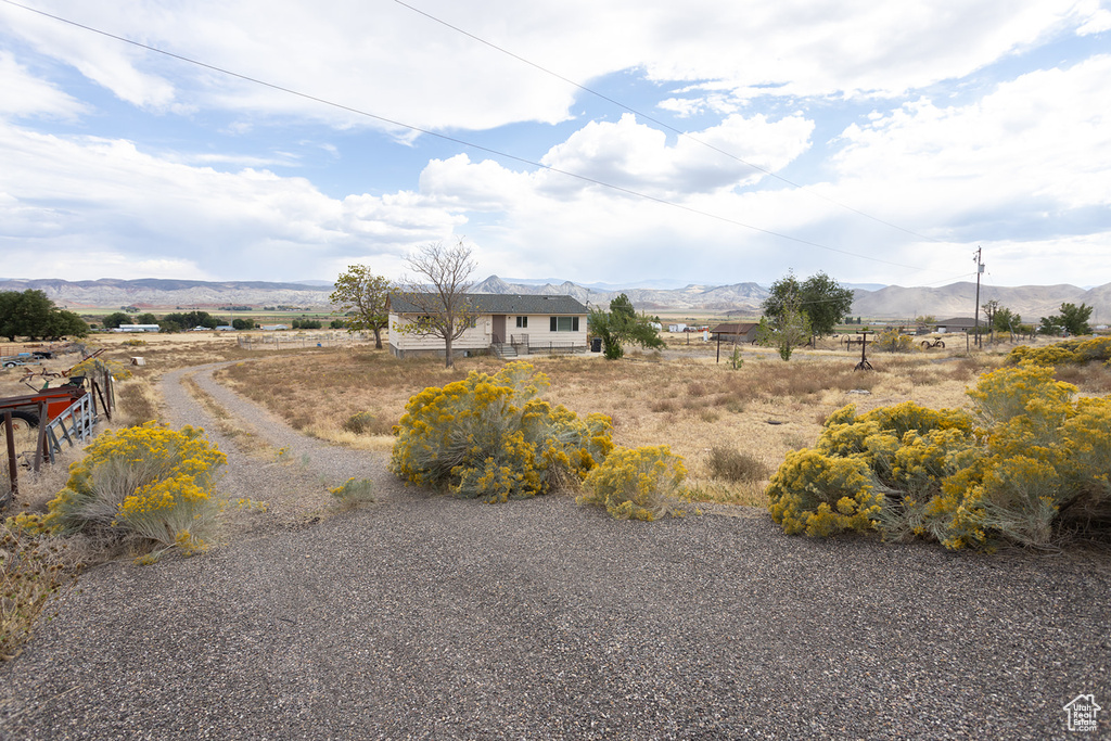 View of yard featuring a mountain view and a rural view