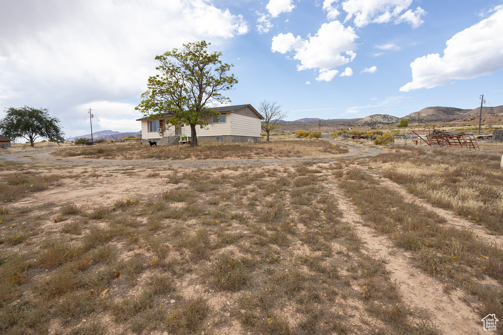 View of yard featuring a mountain view and a rural view