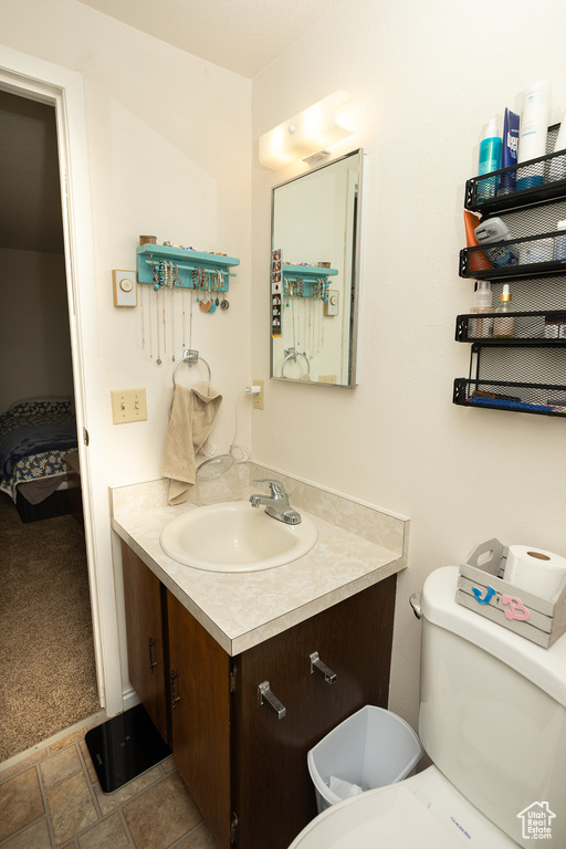 Bathroom featuring vanity and toilet