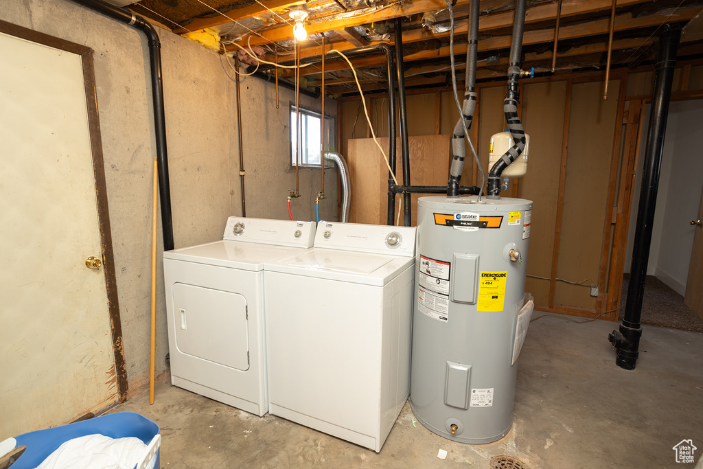 Laundry room with separate washer and dryer and water heater