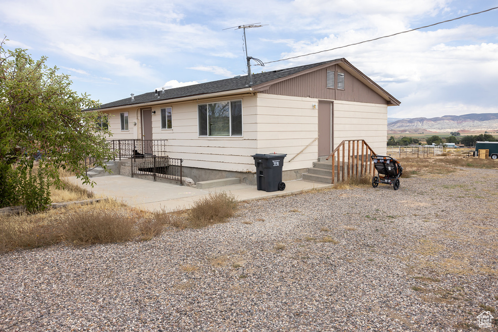 Rear view of property featuring a mountain view