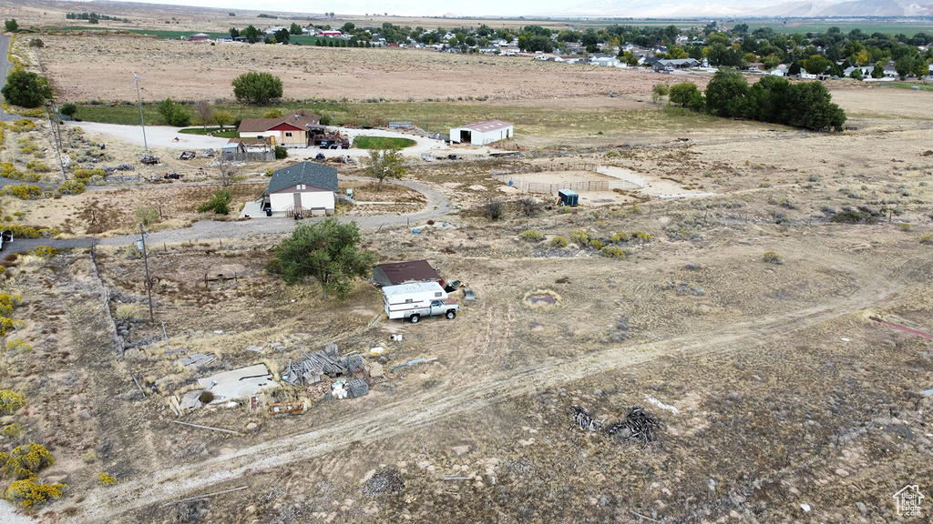 Birds eye view of property with a rural view