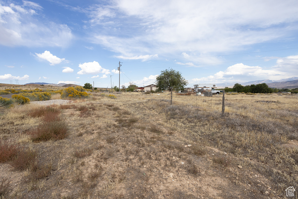 View of yard featuring a mountain view and a rural view