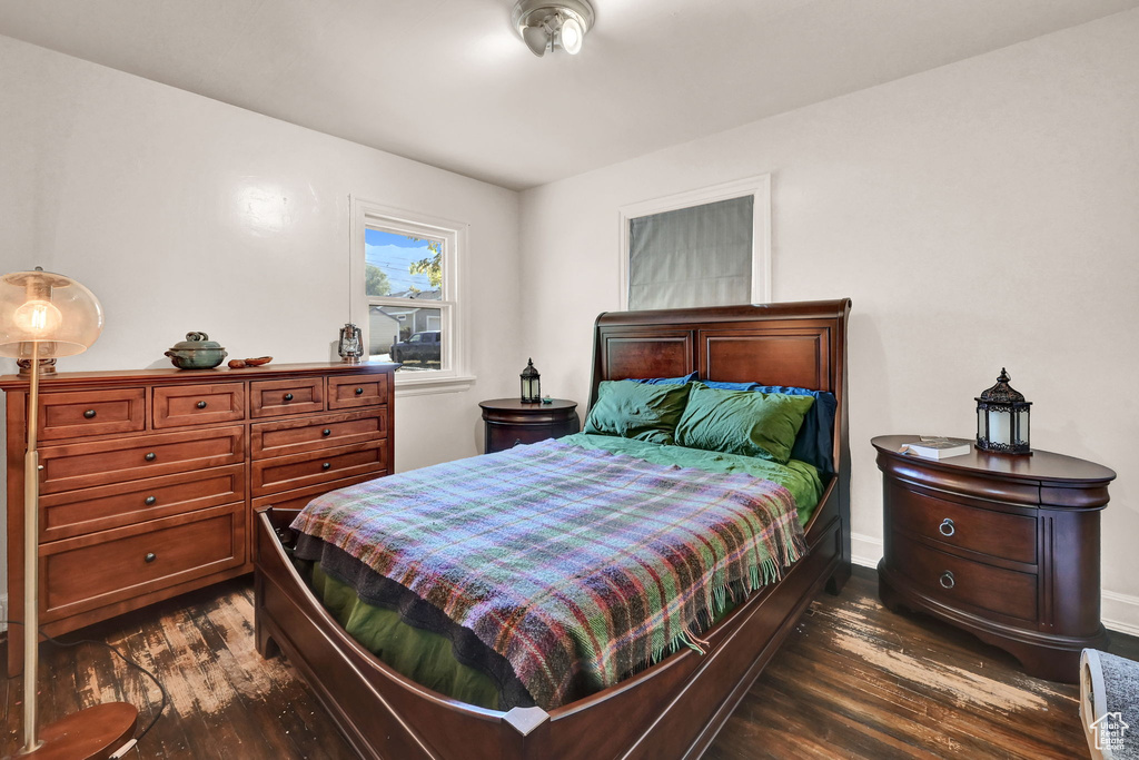 Bedroom featuring dark wood-type flooring