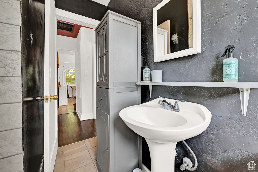 Bathroom with wood-type flooring