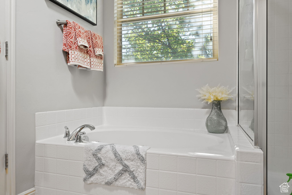 Bathroom featuring tiled bath