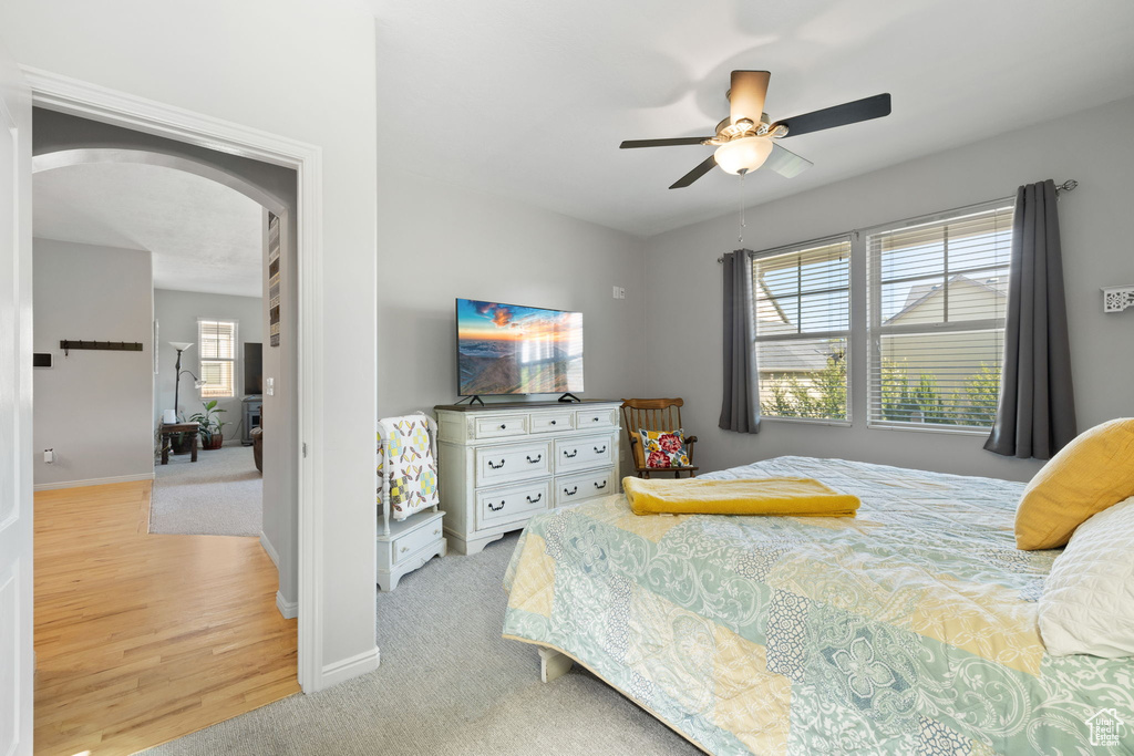 Bedroom featuring ceiling fan and light hardwood / wood-style floors