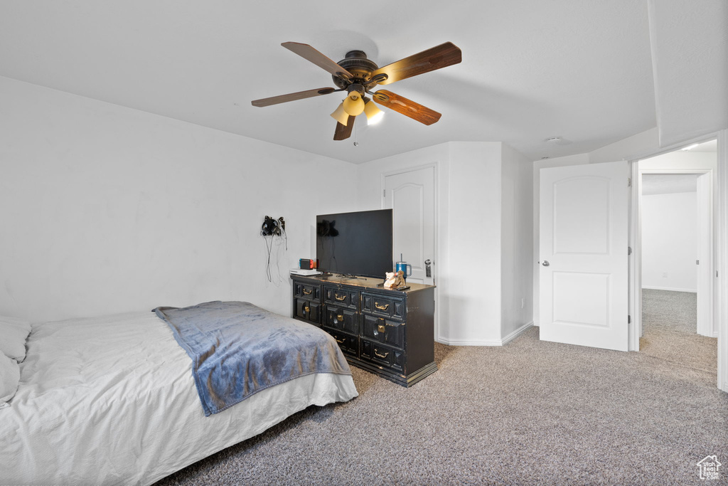 Bedroom with ceiling fan and carpet floors