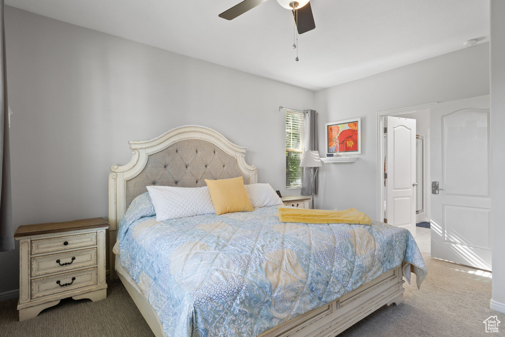 Bedroom with ceiling fan and carpet flooring