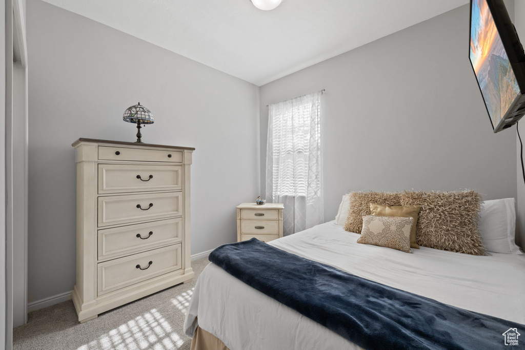 Carpeted bedroom with vaulted ceiling