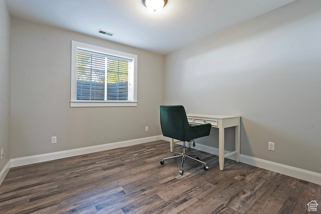 Office area featuring dark hardwood / wood-style flooring