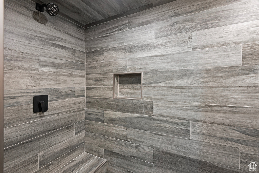 Bathroom featuring a tile shower