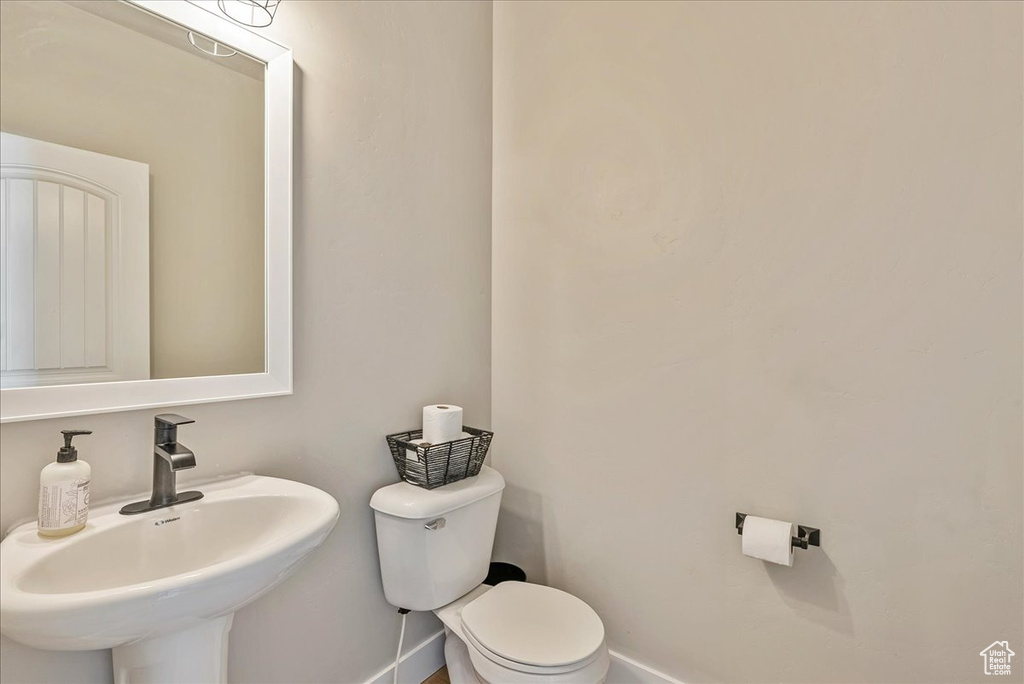 Bathroom with sink and toilet