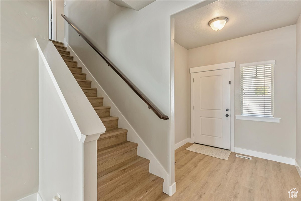 Foyer with light wood-type flooring