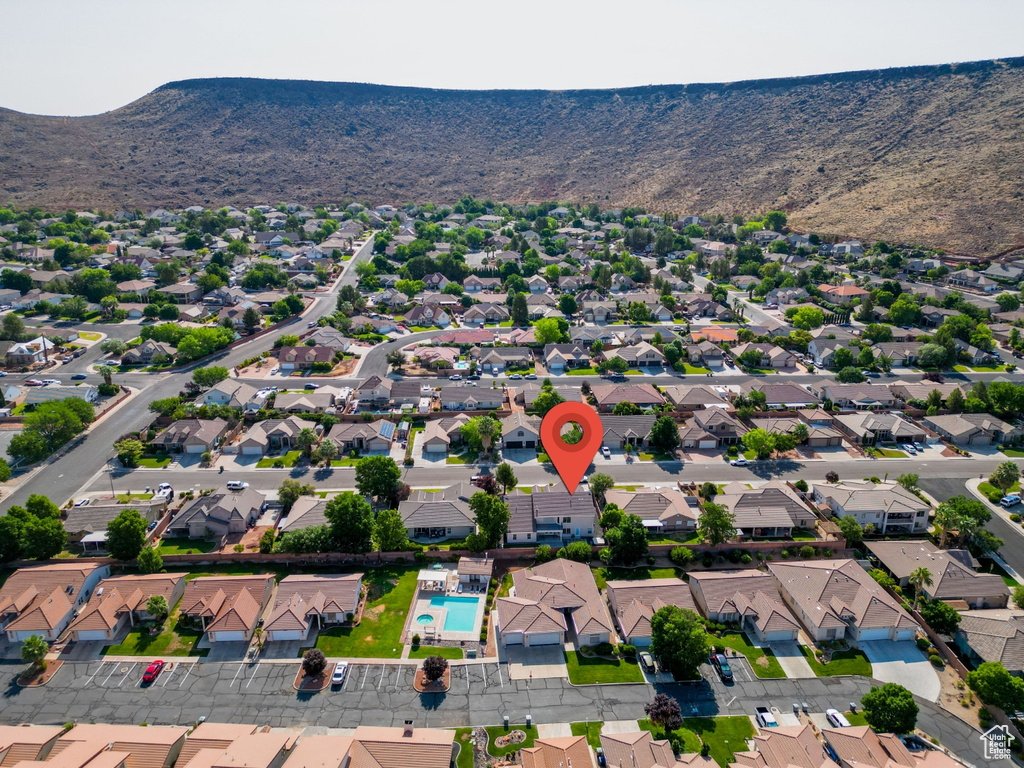 Birds eye view of property with a mountain view