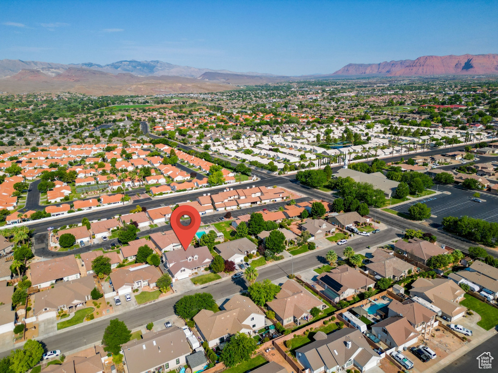 Birds eye view of property with a mountain view