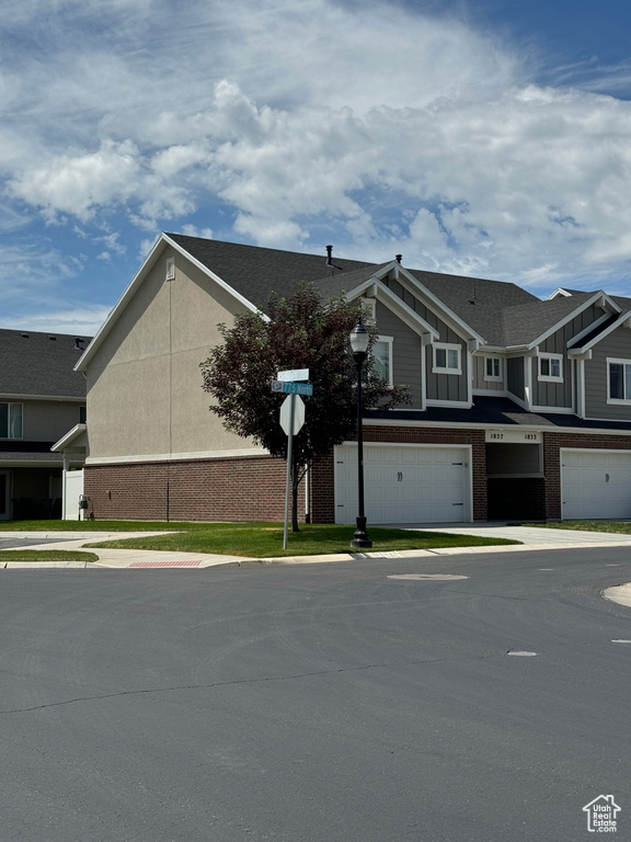 View of front of property with a garage