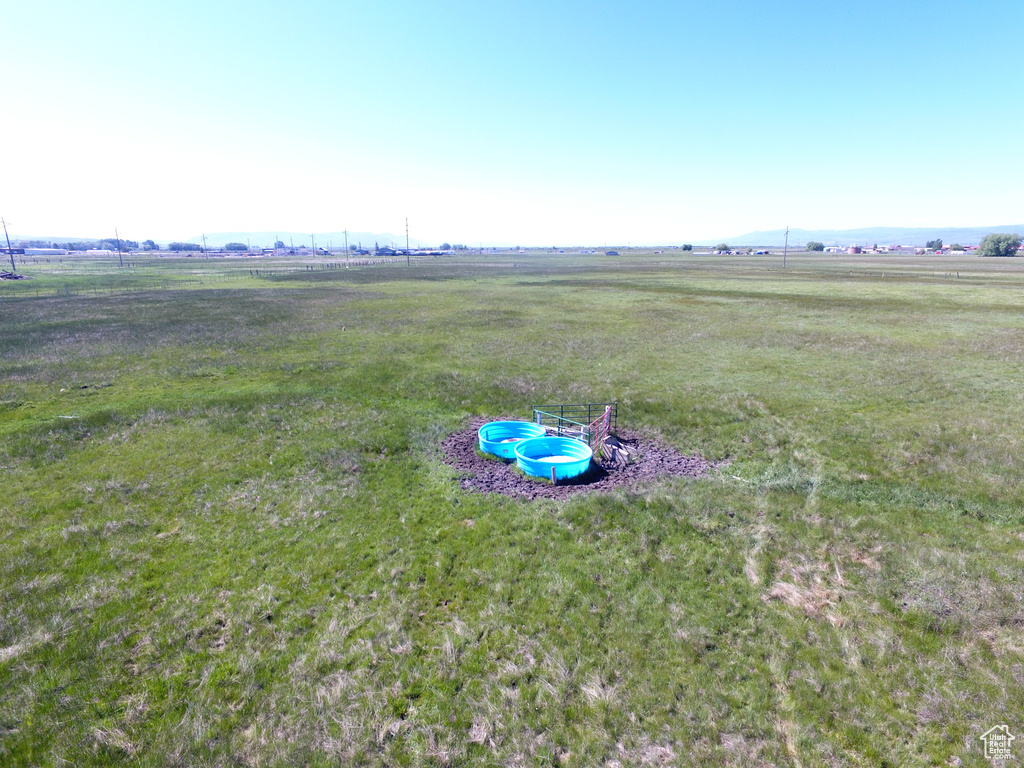 Birds eye view of property featuring a rural view