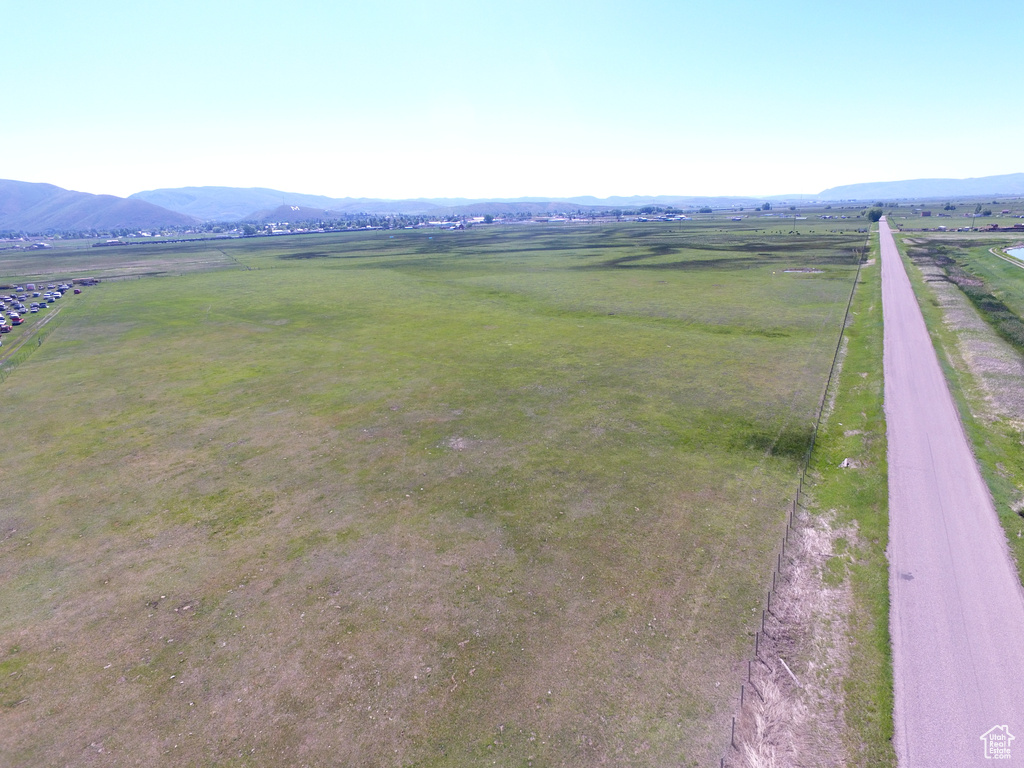 Aerial view featuring a rural view and a mountain view