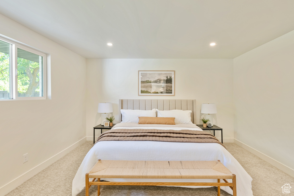 Bedroom with light colored carpet