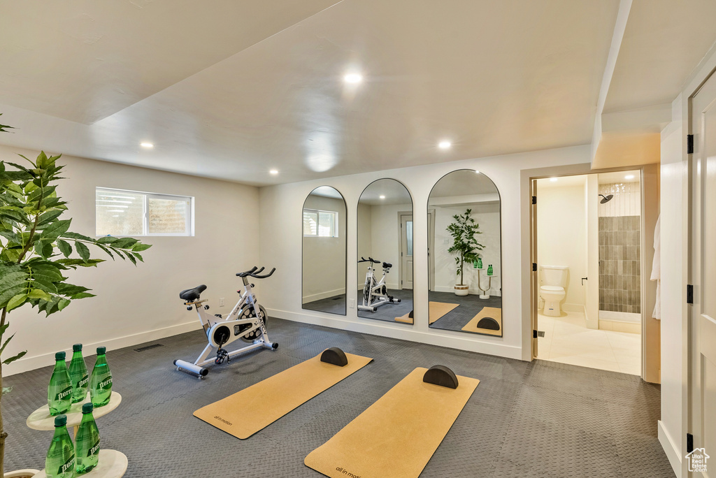 Workout area featuring dark colored carpet