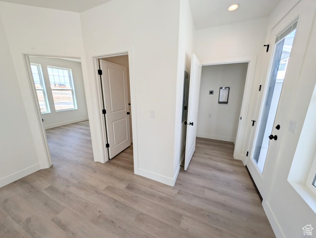 Hall featuring light hardwood / wood-style flooring