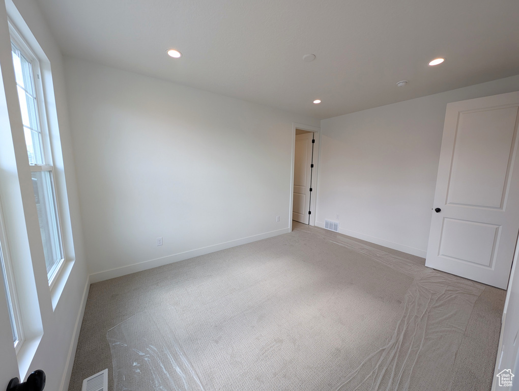 View of carpeted spare room