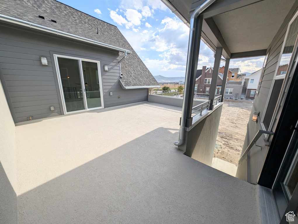 View of patio / terrace featuring a mountain view and a balcony