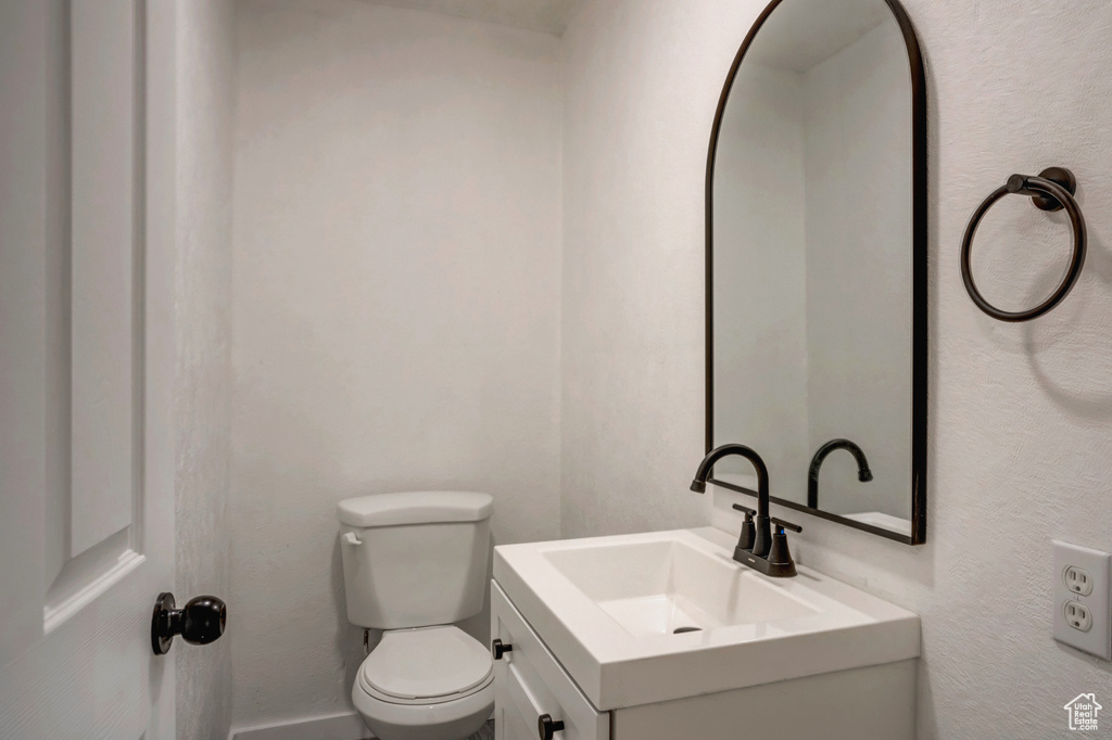 Bathroom with vanity and toilet