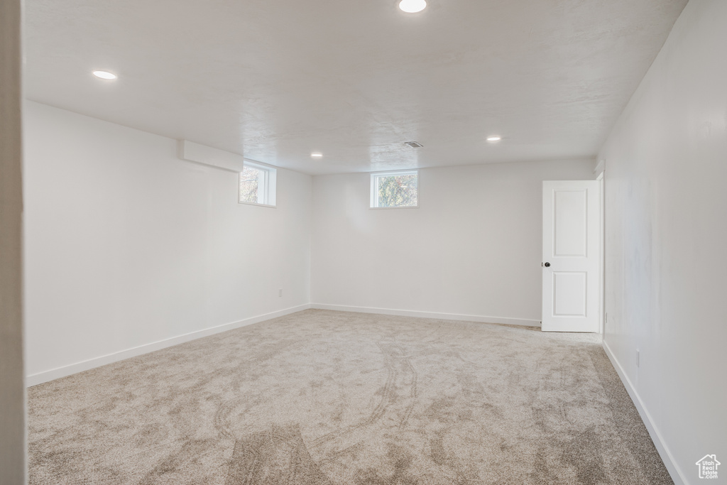 Basement with carpet flooring